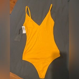 Talula body suit. Brand new with tags. XS